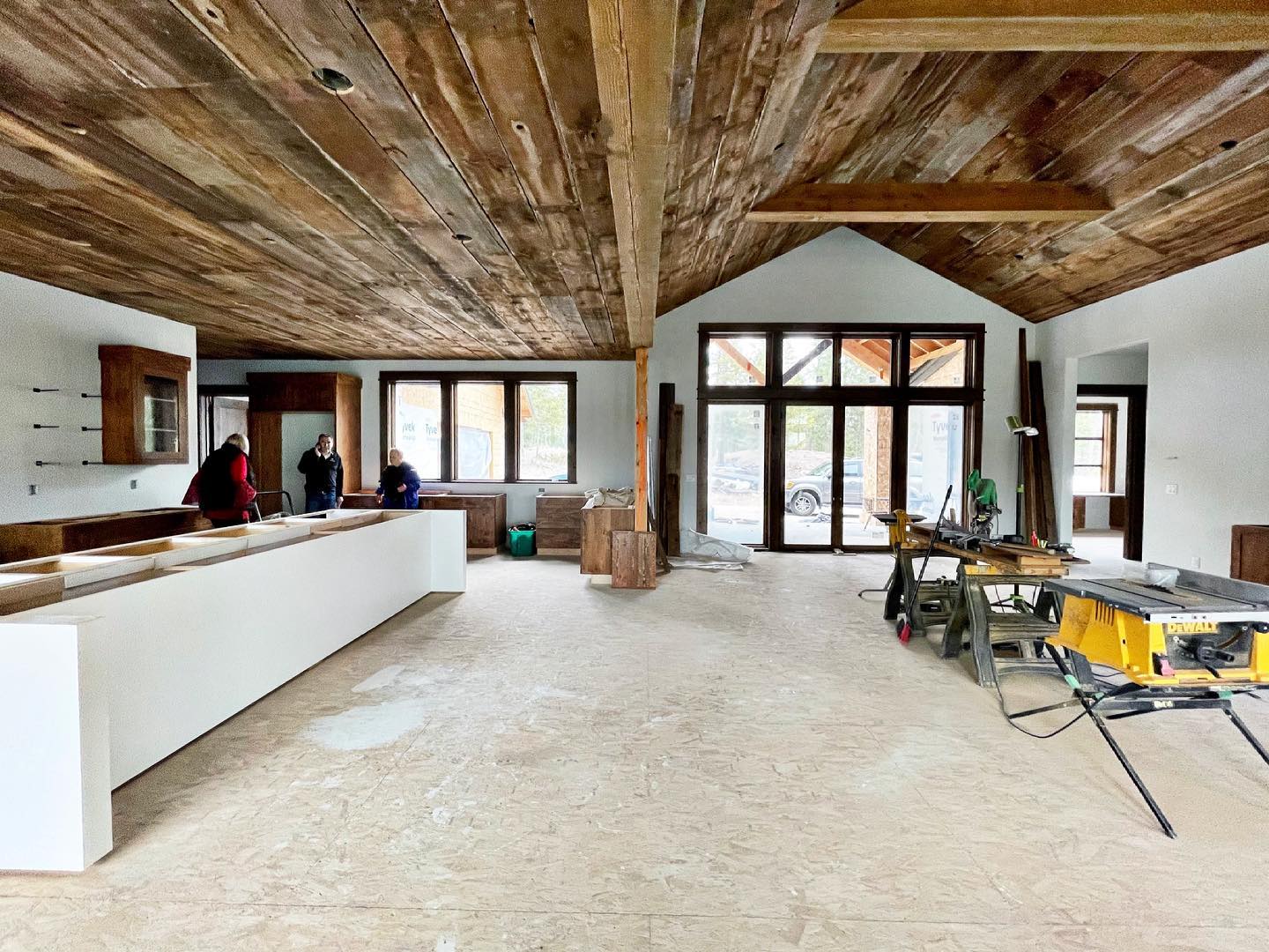 Joe has been working all week to get this barn wood up...it covers the kitchen, dining, and great room, and follows the hallway to the bedroom and mudrooms. It looks amazing! @oldmontanabuilding whitefish custom home builder