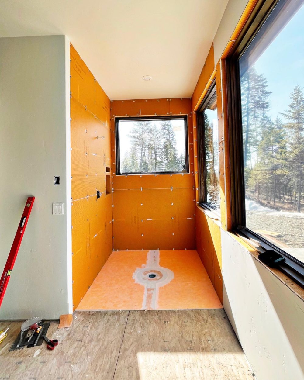 Modern art…and shower rough in. Sort of makes me want to go dark orange?!? Whitefish Custom